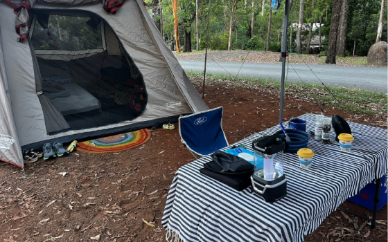 unpowered campsite g6 setup with striped tablecloth at thunderbird park