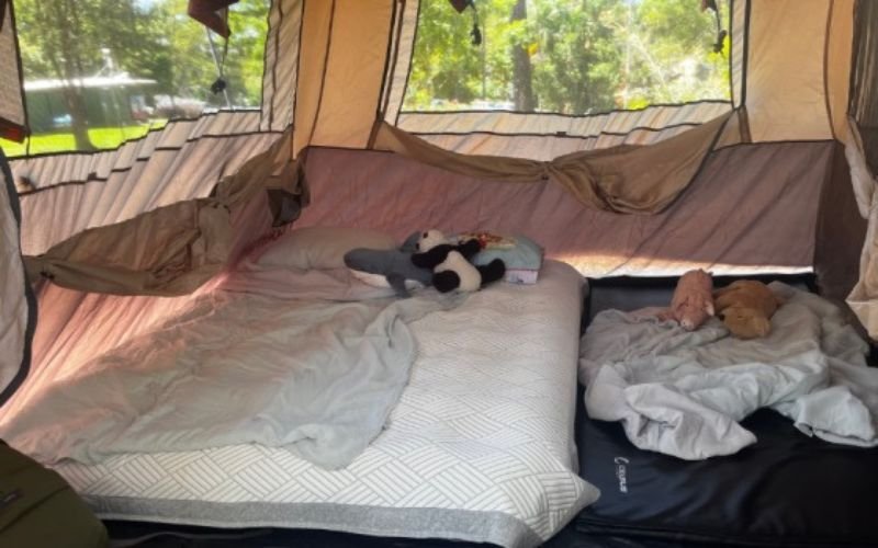 warm kids camping sleep setup with sleeping bag and sleeping pad